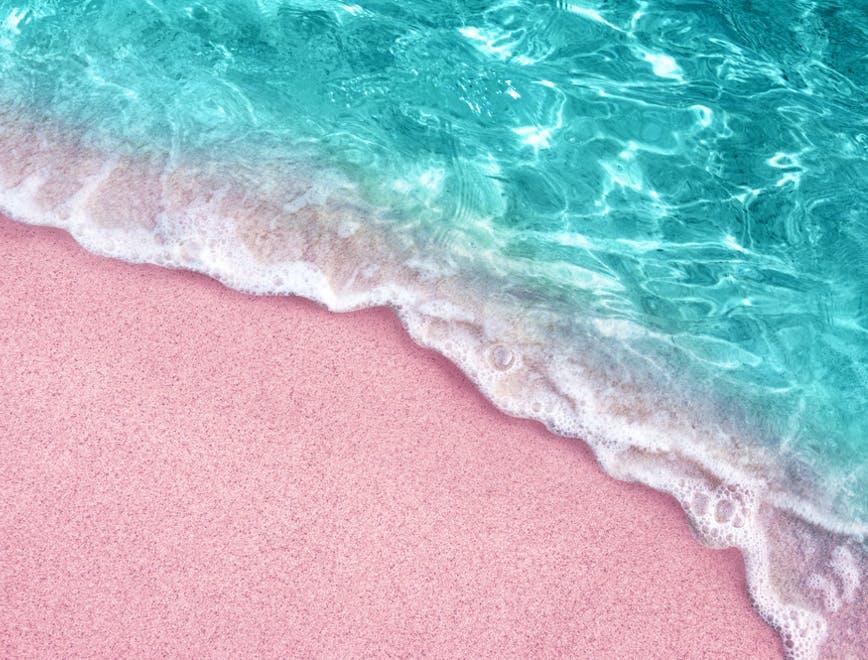 pink sand and azure sea